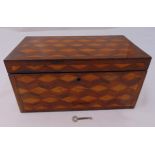 An early 19th century mahogany and satinwood rectangular tea caddy the hinged cover revealing fitted