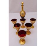 Murano glass decanter and six matching glasses decorated with applied flowers and gilded rims and