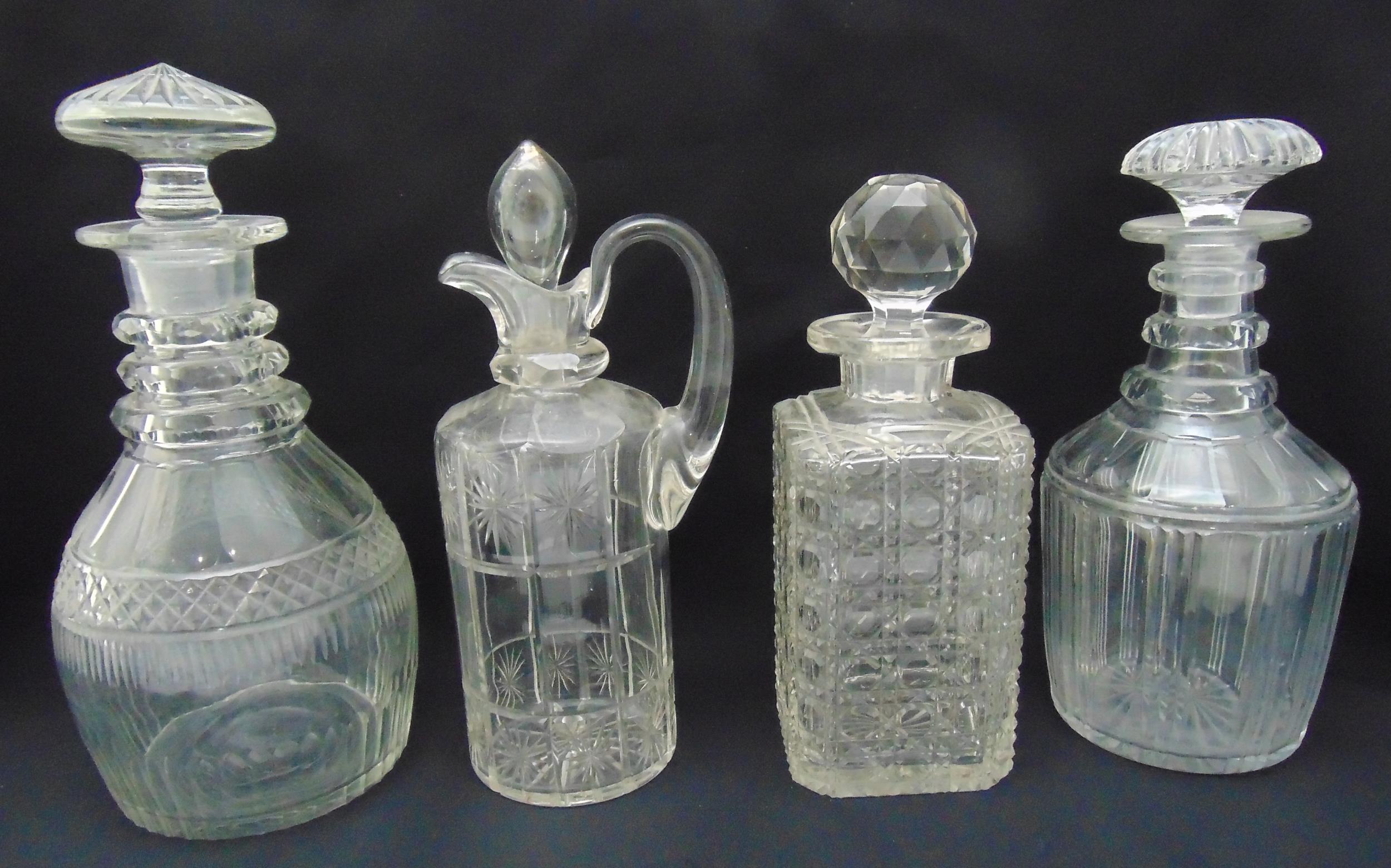 Four 19th century cut glass decanters of various shape and form with drop stoppers