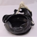 An Art Nouveau ceramic black and white glazed leaf bowl with applied female figure, 29cm (d)