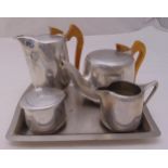 A mid 20th century four piece Picquot ware tea and coffee set with beech handles and a silver plated