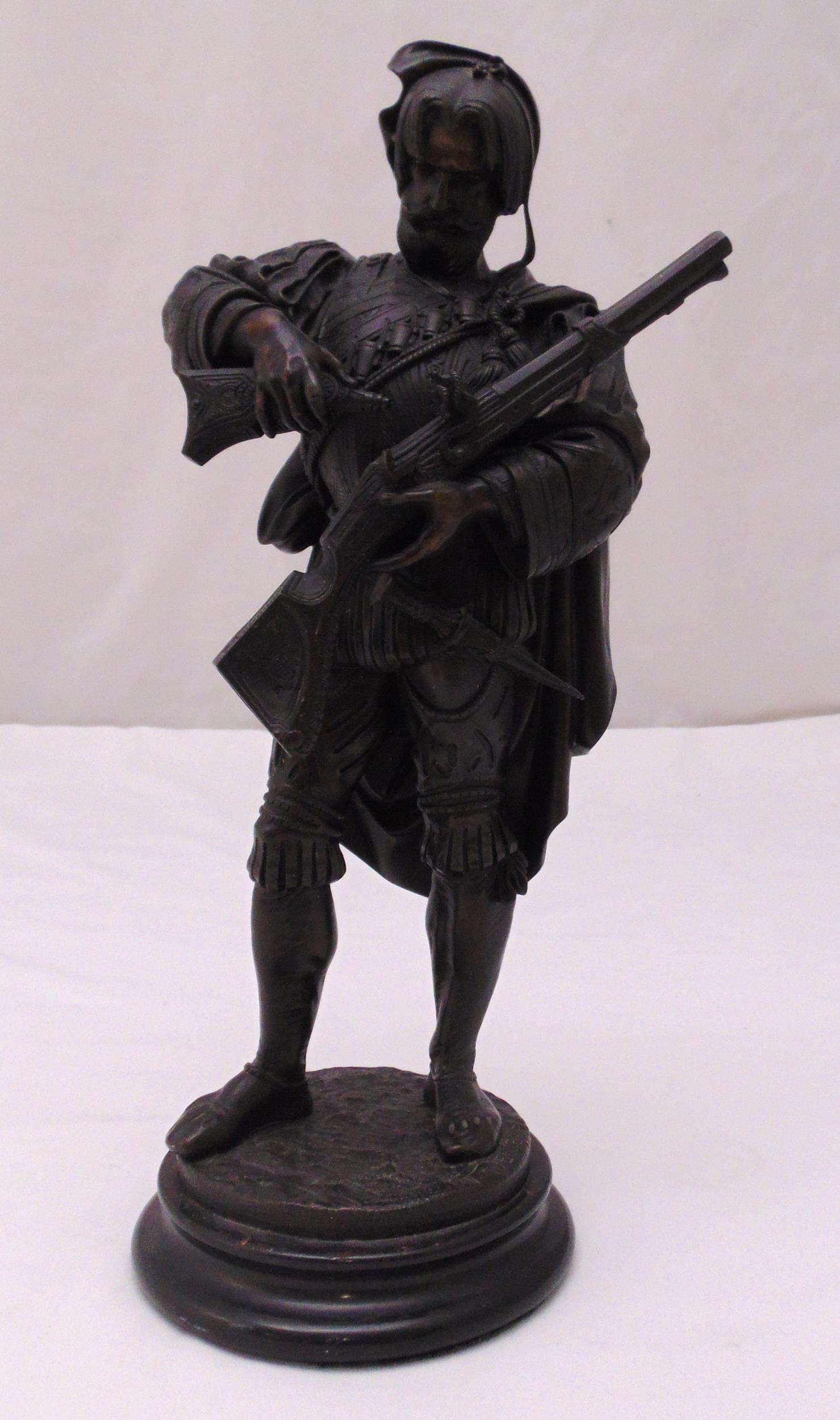 Deniere bronze of a 19th century hunter on raised circular base, signed to the base, 40cm (h)
