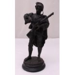 Deniere bronze of a 19th century hunter on raised circular base, signed to the base, 40cm (h)