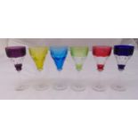 A set of six coloured hock glasses on raised circular bases