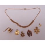 A quantity of 9ct gold jewellery to include a necklace, a tiepin and five pendants, approx total
