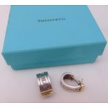 Tiffany and Co. silver and gold earrings in original packaging