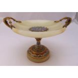 A late 19th century French onyx, champlevé and gilt metal tazza with leaf scroll side handles on