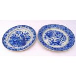 Two blue and white Delft wall plates, decorated with birds, flowers and leaves, marks to bases, 36cm