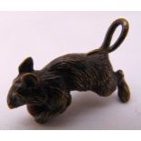 A cold painted bronze mouse on hind legs holding a ball, in the style of Franz Bergman, 4cm (h)