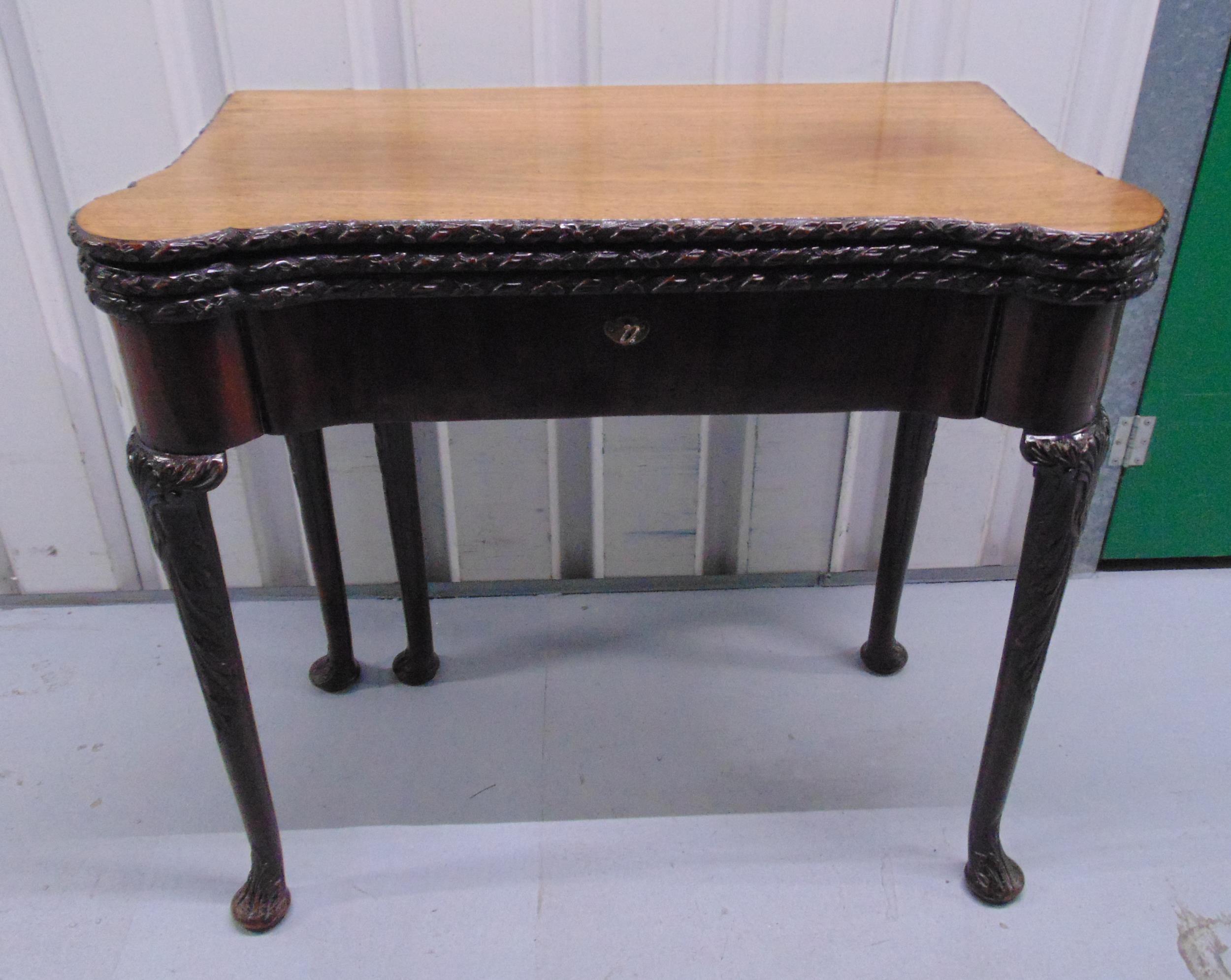 A Victorian rectangular mahogany games table the hinged cover revealing four different playing