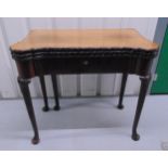 A Victorian rectangular mahogany games table the hinged cover revealing four different playing