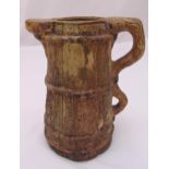 A continental simulated wooden ceramic water jug with double scroll handle, 28cm (h)