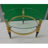 A glass and gilt metal circular coffee table on three baluster legs, 40 x 61cm