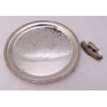 A hallmarked silver card tray, circular with gadrooned border on three scroll supports, Birmingham