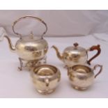 A Victorian hallmarked silver four piece teaset to include a tea kettle on stand with burner, a