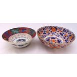 A Japanese Imari bowl decorated with flowers and leaves, character marks to the base, 26cm (w) and