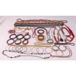 A quantity of costume jewellery to include necklaces, bangles and pendants