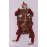 A Far Eastern early 20th century carved wooden puppet with original costume, 70cm (h)