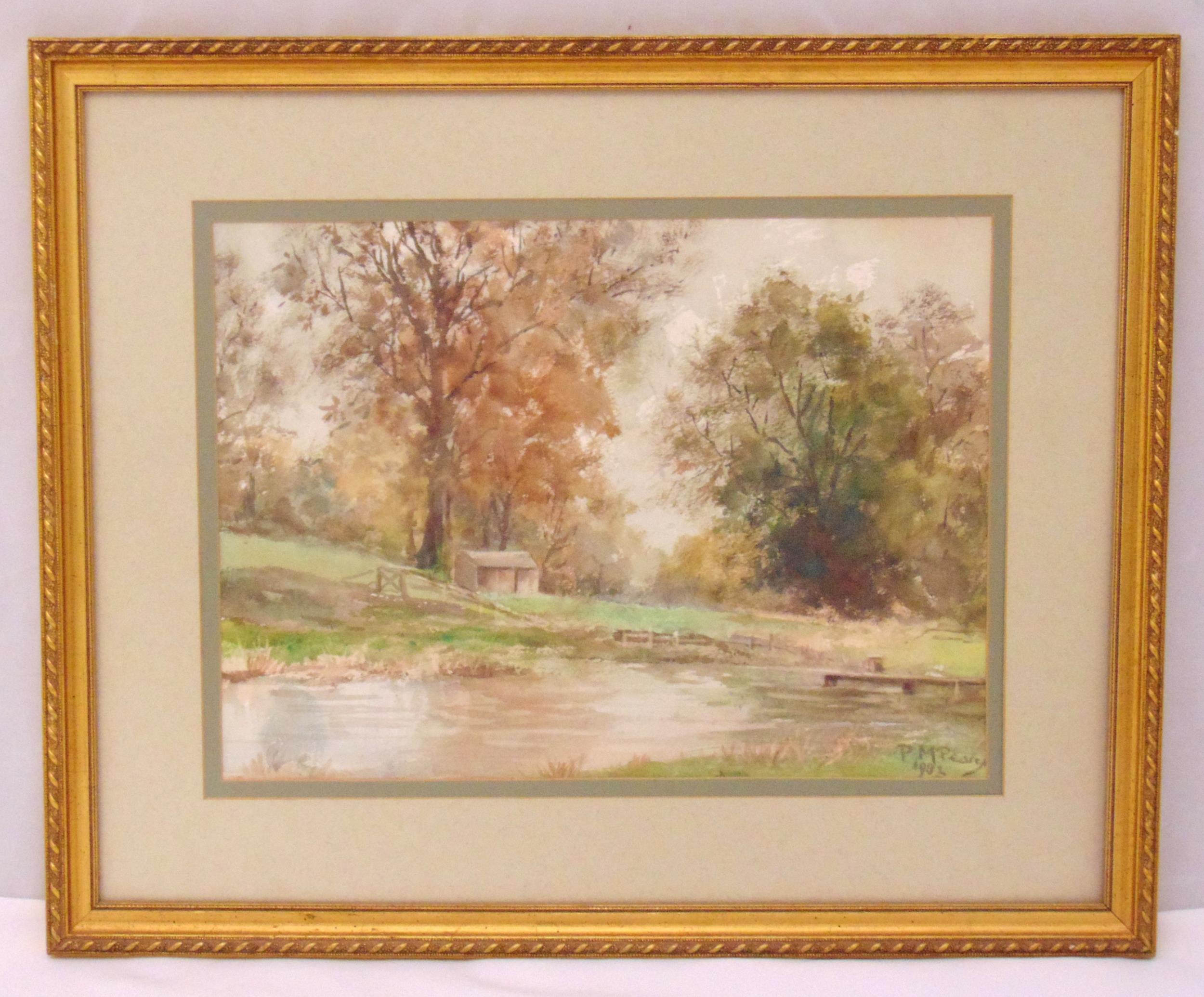 P.M. Pearce framed and glazed watercolour of a country landscape with lake and trees, signed