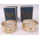 A pair of hallmarked silver napkin rings in original packaging, approx total weight 61.7g