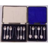 A cased set of hallmarked silver teaspoons and a pair of tongs and a cased set of hallmarked