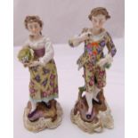 A pair of 19th century Sitzendorf figurines of a boy and a girl on raised shell bases, 18cm (h)