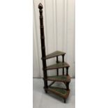 A mahogany library step with inset tooled leather steps and central turned wooden column