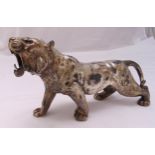 A silver plated figurine of a roaring tiger, 30cm (w)