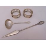 A quantity of hallmarked silver and white metal to include napkin rings and a ladle, approx total