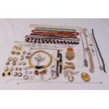 A quantity of costume jewellery to include necklaces, brooches, earrings and watches