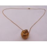 9ct yellow gold pendant in the form of an apple on a 9ct gold chain, approx total weight 10.9g