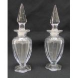 A pair of Chippendale glass crystal scent bottles, the pear shaped bodies on hexagonal bases with