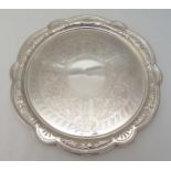 A late Victorian hallmarked silver salver, shaped circular, pierced beaded border, engraved