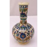 A Middle Eastern baluster vase decorated with flowers and leaves, 32.5cm (h)