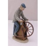 Lladro figurine of a Wheelwright, marks to the base, 30cm (h)