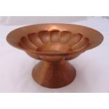A circular spot hammered copper bowl with lobbed sides on a conical base, 15cm (h)
