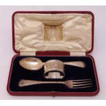 A cased hallmarked silver Christening set to include spoon, fork and napkin ring, Sheffield 1908,