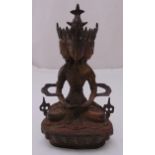 A Chinese multi face Buddha on raised shaped oval base, 31cm (h)