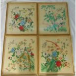 A set of four framed and glazed oriental hand painted silk images of birds, flowers and trees,