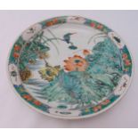 A Chinese famille verte dish decorated with birds and flowers, six character marks to the base, 28cm