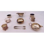 A quantity of hallmarked silver to include a sauce boat, a cream jug, a sugar bowl, a pair of