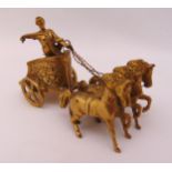 A hallmarked silver gilt model of a chariot driven by three horses, London 1966, approx total weight