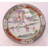 A Cantonese charger decorated with figures in landscapes, 32.5cm (dia)