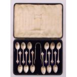 A cased set of twelve hallmarked silver coffee spoons and a pair of matching tongs, Sheffield 1903