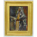 A framed oil on panel of a Rabbi wearing Tefillin and Tallis holding a Torah, mid 20th century