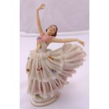 Dresden figurine of a ballerina wearing a lace dress, marks to the base, A/F, 21.5cm (h)