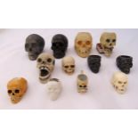 A quantity of porcelain, ceramic and metal miniature skulls (12)