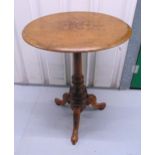 A mahogany circular inlaid occasional table on three scroll legs, 70 x 53cm