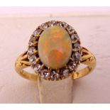 A yellow gold opal and diamond ring, approx total weight 3.1g