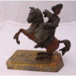 A bronze figurine of a Middle Eastern warrior on horseback all on raised octagonal base, 22 x 26 x